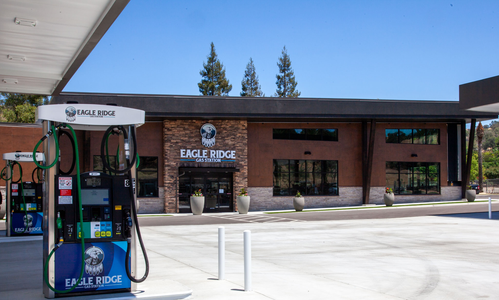 Gas pumps and the front of the Eagle Spring Gas Station building.